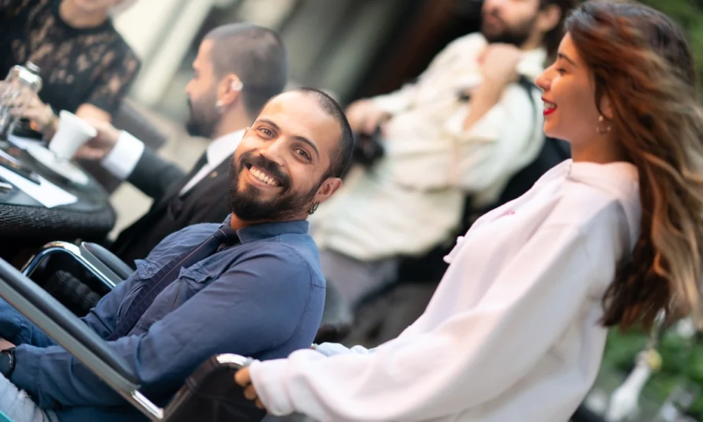 Man in wheelchair smiling at camera
